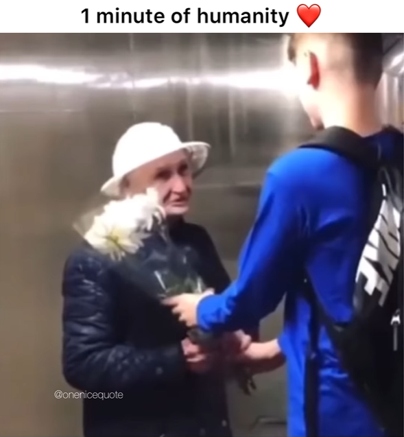 1 minute of humanity Boy handing an older woman flowers. The title at the top reads: "1 minute of humanity"